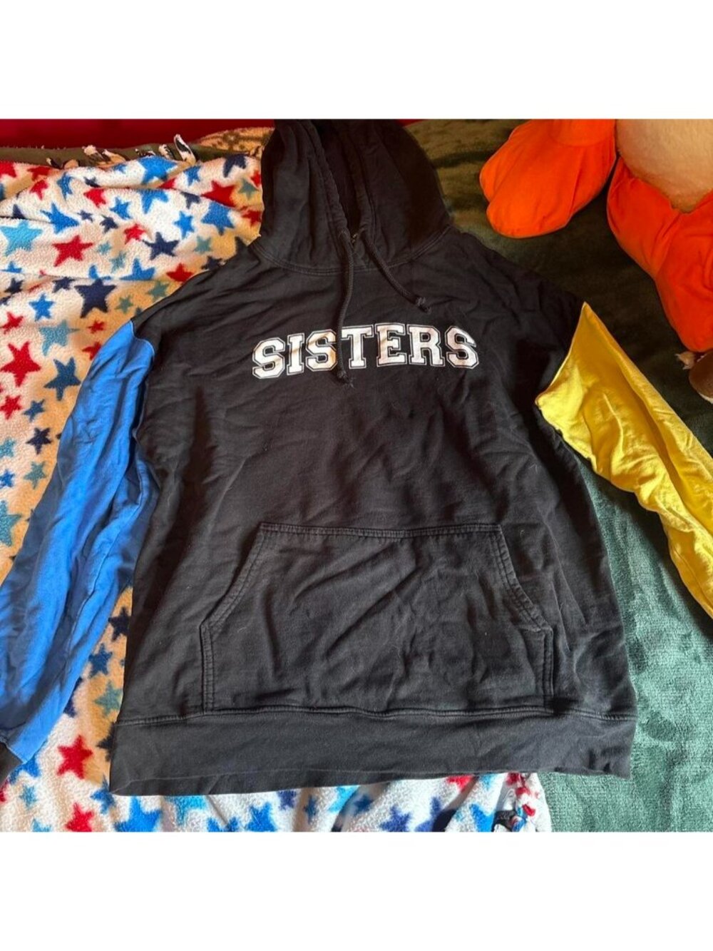James Charles Black hoodie with blue sleeves and white